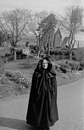 HOODED CLOAK ( MRS O'LEARY ) AT PAROCHIAL HOUSE